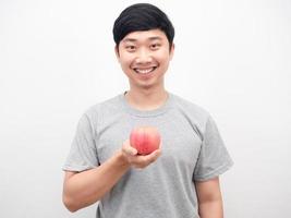 Asian man cheerful smiling holding red apple health concept photo