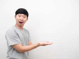 Asian man show empty hand for product concept copy space photo