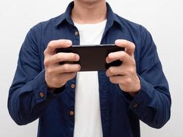 Closeup crop body of man using mobile phone in his hand,Man playing social media with his smartphone portrait photo