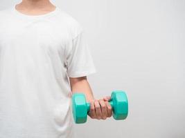 Man holding dumbbell green clolor white background crop shot copy space photo