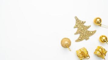 Golden christmas accessories on white background top view copy space photo