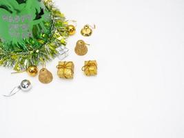 Christmas items with green hat on white background top view copy space photo