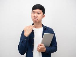 Man holding tablet serious face gesture cut his neck photo