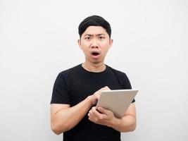 Man using tablet feeling amazed white background photo