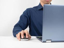 Man using laptop for working at the table copy space photo