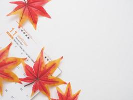 Maple leaf on the calendar top view copy space white autumn concept photo