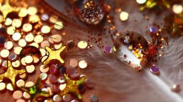 Close-up Of water drop with glitter on it in different colorful loghts in Karachi Pakistan 2022 photo
