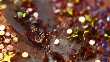 Close-up Of water drop with glitter on it in different colorful loghts in Karachi Pakistan 2022 photo