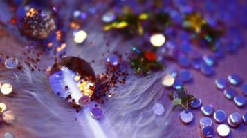 Close-up Of water drop with glitter on it in different colorful loghts in Karachi Pakistan 2022 photo