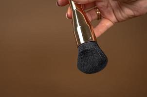 A brush for applying foundation for the face. Elite level cosmetics. A series of shots. Part-3 photo