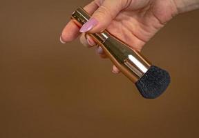 A brush for applying foundation for the face. Elite level cosmetics. A series of shots. Part-2 photo