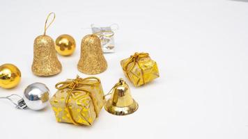 Close up Christmas ornaments gold and silver color on white isolated copy space photo