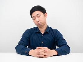 Businessman feeling tried from working sleep at the table white background photo