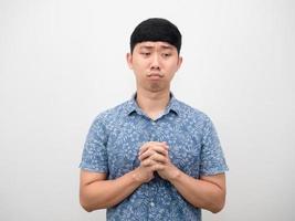 Asian man blue shirt gesture joy hand feeling sad photo