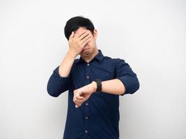 Man looking his watch but close his face white background photo