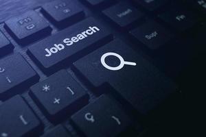 Job search button on black keyboard. Find your career. Using online website to find a job. photo