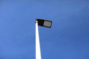 Modern street lighting against blue sky - bottom view - horizontal image. High quality photo