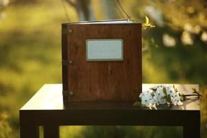 wooden photobook on the table. place for the inscription photo