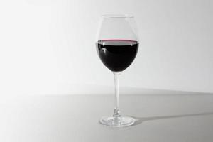 Glass of red wine isolated on white background. A glass of red wine. Copy space. photo