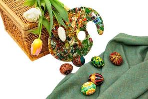 Easter eggs and tulips. Easter eggs with tulips on a white background, easter holiday concept. photo