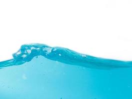 Blue water splashes and bubbles on a white background, Clear blue water and waves photo