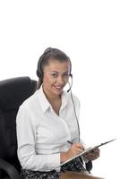 Personal assistant in the business. Hot helpline worker. Female Operator of call center with headset in white shirt photo