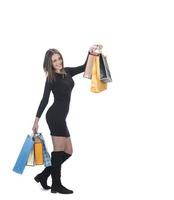 Happy woman full body portrait with shopping bag on isolated studio background. photo