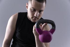 male holding  dumbbells photo