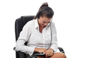 Personal assistant in the business. Hot helpline worker. Female Operator of call center with headset in white shirt photo