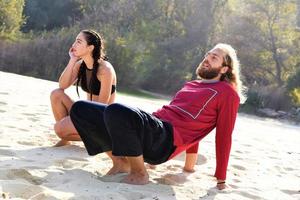 friends relaxing and talking on the beach photo