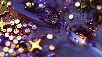 Close-up Of water drop with glitter on it in different colorful loghts in Karachi Pakistan 2022 photo