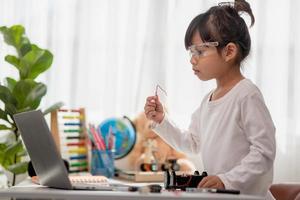 Asia students learn at home in coding robot cars and electronic board cables in STEM, STEAM, mathematics engineering science technology computer code in robotics for kids concept. photo