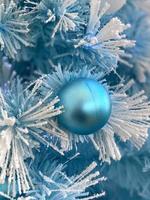 blue christmas ball on branch photo