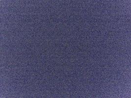 Colored noise, blue textured background. Denim cotton fabric. photo