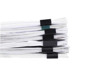 Stack of papers with paper clips, office folders. White isolated background. photo
