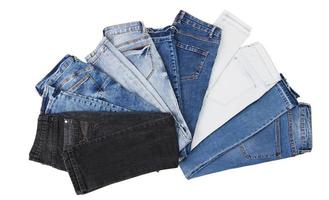 a set of multi-colored jeans on a white background close-up photo