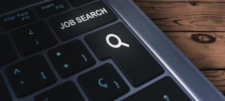 Banner of laptop keyboard with the words job search on buttons. Find your career. Using online website to find a job. photo