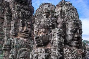 Prasat Bayon with smiling stone faces is the central temple of Angkor Thom Complex, Siem Reap, Cambodia. Ancient Khmer architecture and famous Cambodian landmark, World Heritage. photo