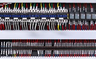 Close up circuit breakers and wire in control panel photo