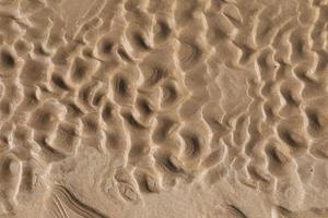 Natural sand patterns on the beach at low tide.copy space. photo