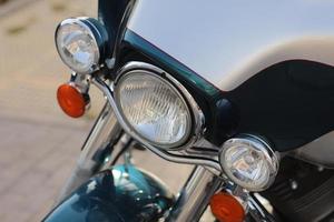 close up of retro headlights. motorcycle parked on the motorcycles parking lot. Meeting of bikers before a join trip through the city street. photo