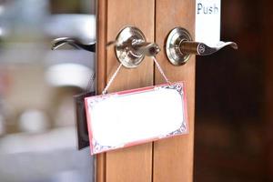 empty white board hanging on the door photo