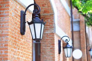 Vintage light lamp on the brick wall photo