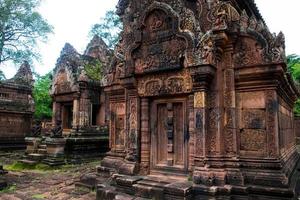 Banteay Srei is built largely of red sandstone and is a 10th-century Cambodian temple dedicated to the Hindu god Shiva, Siem Reap, Cambodia photo