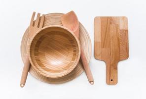 Handmade wooden, vintage kitchen utensils on white table photo
