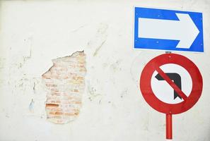 arrow traffic sign with old wall photo