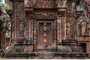 Banteay Srei is built largely of red sandstone and is a 10th-century Cambodian temple dedicated to the Hindu god Shiva, Siem Reap, Cambodia photo