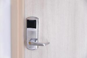 Entrance wood door with electronic keycard lock system photo