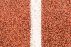 The surface of Running track and white line photo