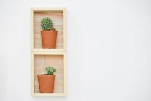 Wooden shelf on white wall photo